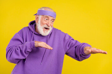 Photo of cheerful senior man have fun club dancer music dj cool isolated over yellow color background
