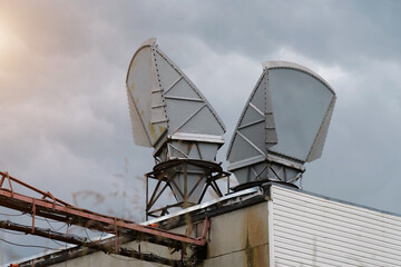 Horn antennas on clouds background