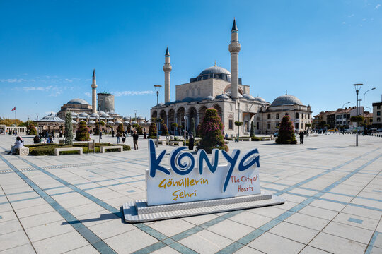 Konya, Turkey - September 2021: Konya old town's central square with the Mevlana Museum and Selimiye Mosque. Konya is a pilgrimage destination for Sufis, focused on the tomb of the Mevlana order, Rumi