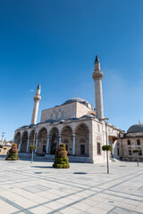 Fototapeta na wymiar Konya, Turkey - September 2021: Selimiye Mosque in Konya central square. Konya is a pilgrimage destination for Sufis, focused on the tomb of the Mevlana order, Rumi