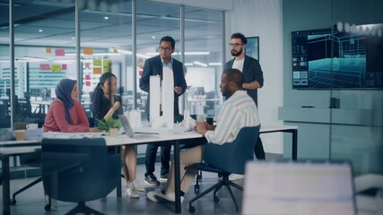 Modern Multi-Ethnic Architectural Agency Office Meeting. Group of Professional Architects, Designers, Developers, Investors Use TV with 3D Building Model to Design Sustainable Housing Project