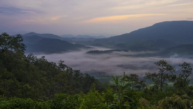 4K Timelapse of Morning fog over mountain and forest in monsoon at Phu sa nao viewpoint located in Uttaradit province, Thailand