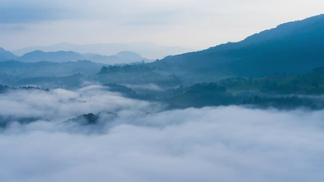 4K Timelapse of Morning fog over mountain and forest in monsoon at Phu sa nao viewpoint located in Uttaradit province, Thailand