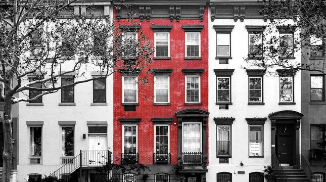 Red Brick Building Isolated Against Row Of Old Black And White Buildings In Manhattan New York City