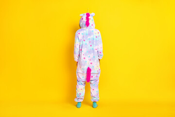 Back rear view full size photo of young afro woman incognito spine wear pajamas isolated over yellow color background