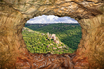 View of the ancient ruined castle (Mountain Fortress) through a rocky window