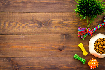 Pet accessories top view. Dry dog and cat food with toys