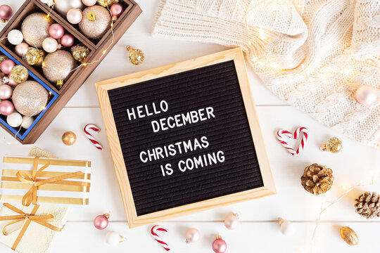 Felt letter board with text hello december, Christmas is coming and xmas decoration. Winter holidays celebration concept. Flat lay, top view