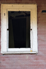 Fototapeta na wymiar An old broken window in frame