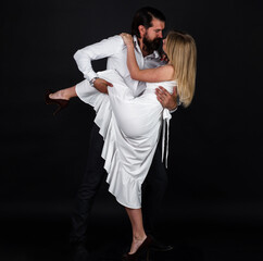 Dancers in ballroom. Romantic couple dancing tango.