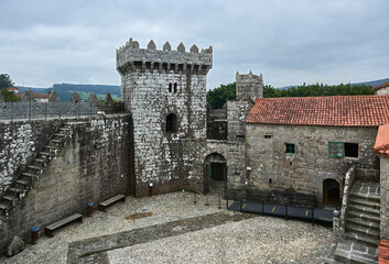 Obraz premium inner courtyard of the castle, tower, battlements, merlons and red tile roofs