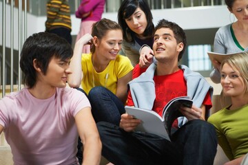 University students sitting on steps