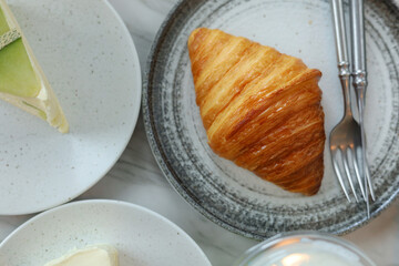Freshly baked croissant shiny in the coffee cafe