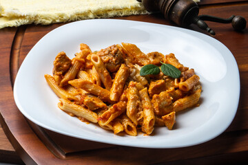 Penne pasta in tomato sauce with chicken