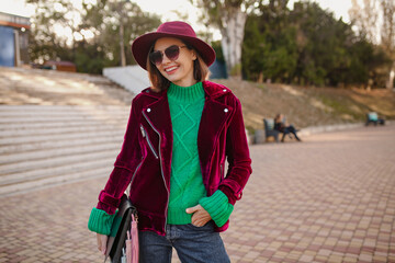 attractive woman in autumn style trendy outfit walking in street