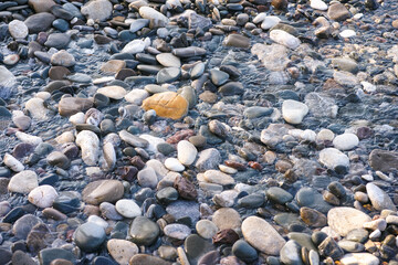 Water flowing through sea pebbles
