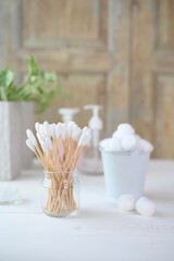 White cotton swabs cotton bud and cotton ball on background