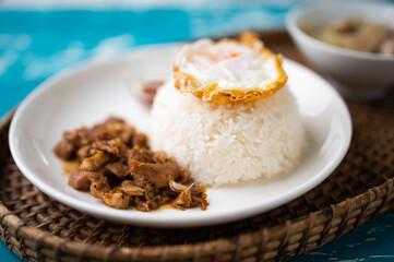Fried Pork with Garlic, Pepper and fried egg on rice. Easy thai food.