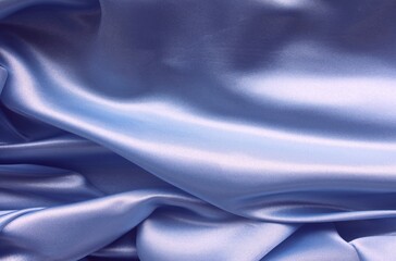 Blue satin background. Silk fabric with pleats. Satin, silk or satin create a beautiful drapery. Fashionable design.