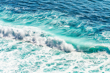 Turquoise wave on the Bali beach