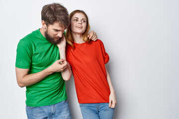 man and woman hug friendship colorful t-shirts family studio lifestyle