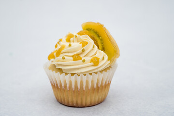 Lulo cupcake with white cream on a marble background