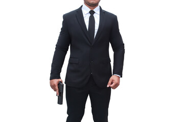 A gun man wearing a black suit is holding a gun in a stalwart pose on a isolated white background....