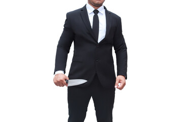 A businessman wearing a black suit stands with a knife on a white background isolated.businessman murder.