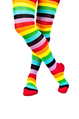 legs of a woman with colorful raibow high socks