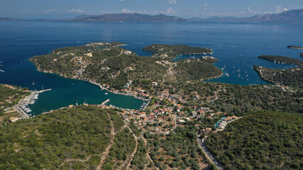 Fototapeta na wymiar Aerial drone photo of fjord bay and port of Vathi a natural sail boat anchorage in island of Meganisi, Ionian, Greece