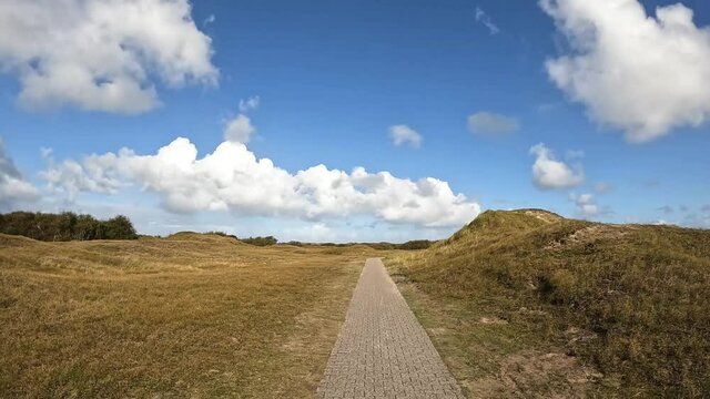 Walking along a hiking path in the nature reserve Norderney Germany