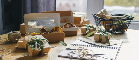 Christmas gift. gift box,zero waste, eco friendly hand made box packaging gifts in kraft paper table, eco christmas holiday concept, Christmas gift wrapping,eco decor banner