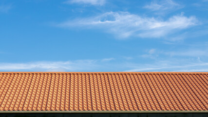 Orange brick rooftop under blue sky and white cloud, Tiles background details, Shingles texture, Abstract geometric pattern, Roof brick material.