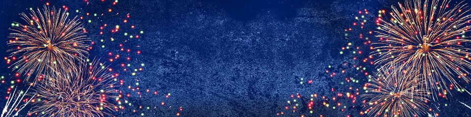 Silvester, new year background - fireworks on rustic dark blue stone concrete texture, top view...