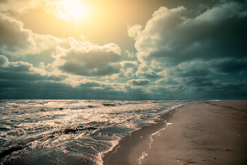 Seascape in the afternoon with partly cloudy sky. Dramatic nature landscape with stormy sea