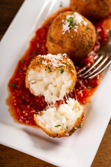 Mozzarella arancini, stuffed rice balls, italian appetizer