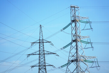Power transmission towers against the blue sky.