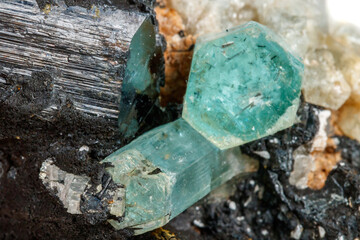Macro mineral stone Aquamarine and black tourmaline, Schorl on a white background