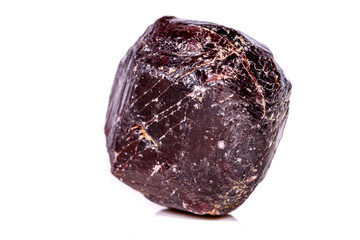 Macro of a mineral garnet stone on a white background