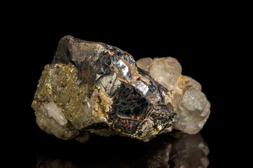 Macro of a mineral stone Sphalerite with fluorite and pyrite on a black background close up