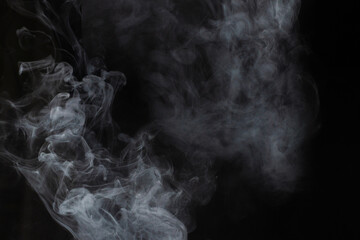 White steam on a black background.