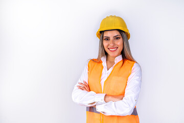 Beautiful young female engineer or supervisor, wearing safety equipment, on white background with room for text or copy space. Concept of empowered woman, professional woman, professional job.