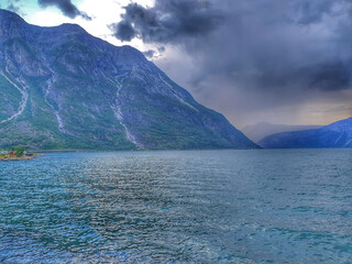 cloudy sky over the mountains and the fjord - Eidfjord