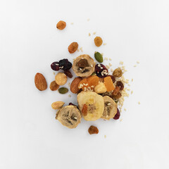 a handful of a mixture of natural fruits and grains, muesli, natural breakfast, healthy food