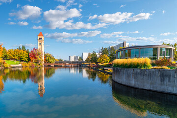 Sunny Autumn day along the Spokane River at Riverfront Park in downtown Spokane, Washington, USA, with the clock tower and carousel in view.