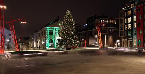 Big Christmas tree in Tallinn city on square in new quarter Noblessner Port. Kalamaja area.