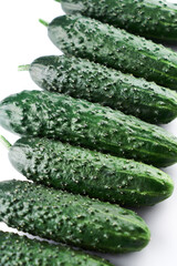 Set of fresh whole cucumbers on white background, food pattern. Garden cucumber wallpaper backdrop design