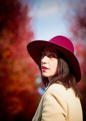 woman in red hat in an autumnal park
