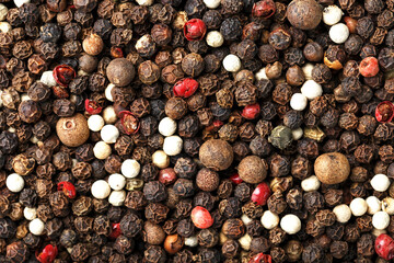 Seeds of a mixture of peppers close-up in full screen.