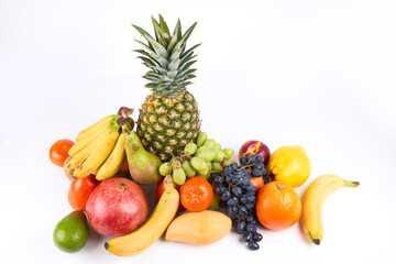 Fototapeta na wymiar Mix of fresh juicy colorful exotic tropical fruits on white background